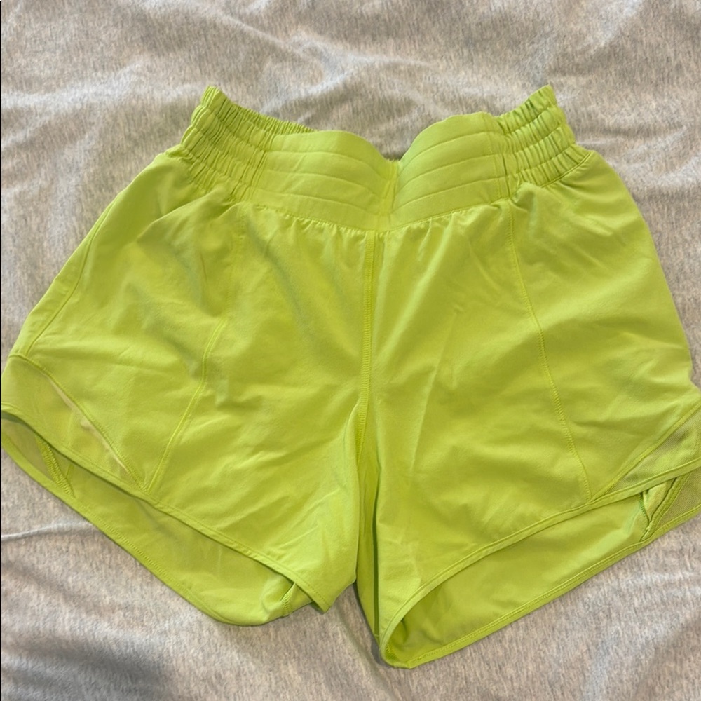 Lululemon hottie high rise 4” short in lime green size 4 see small mark in photo